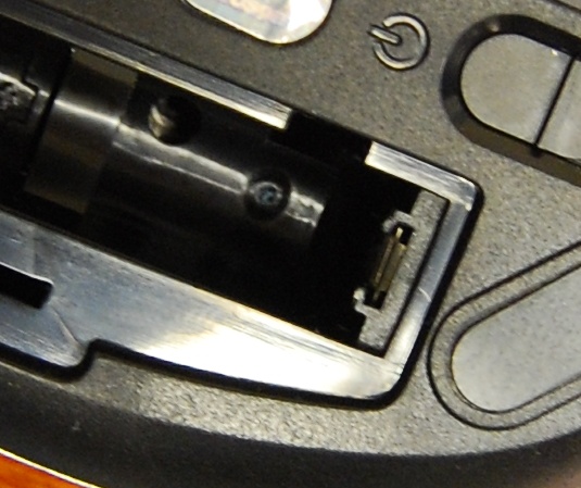 Battery removed showing the plastic rails at the positive conductor